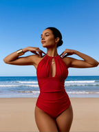 Red halter one-piece swimsuit with high neck and central keyhole cutout