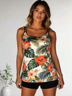 Tropical floral tankini swim top with spaghetti straps and black swim shorts