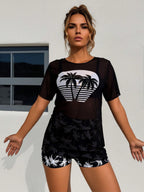 Black sheer swim cover-up with heart coconut palm graphic and matching shorts