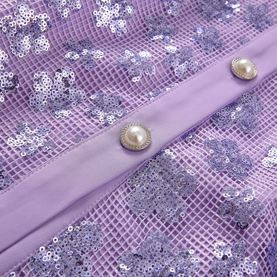 Lavender sequined fabric close-up with pearl-tone button tab on front belt strap
