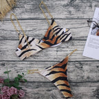 Tiger-stripe triangle bikini top and bottom with gold chain strap details
