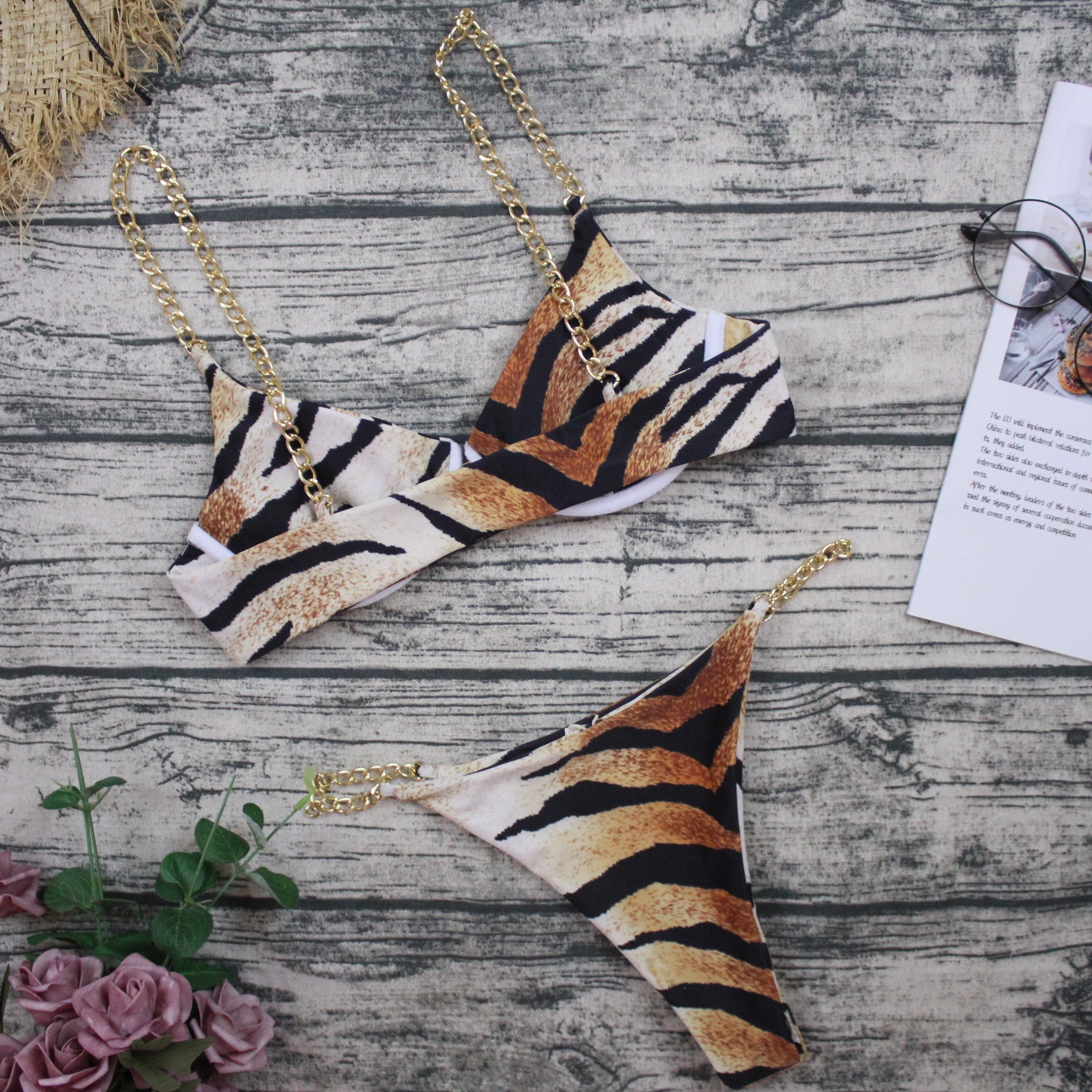 Tiger-stripe triangle bikini top and bottom with gold chain strap details