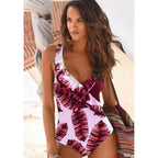 Pink-and-purple one-piece swimsuit with V-neck and ruffle trim