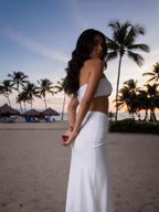 White strapless bikini set with gold medallions, shown in a side view