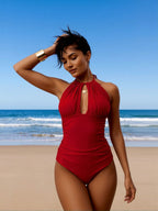 Red halter one-piece swimsuit with keyhole cutout and ruched bodice
