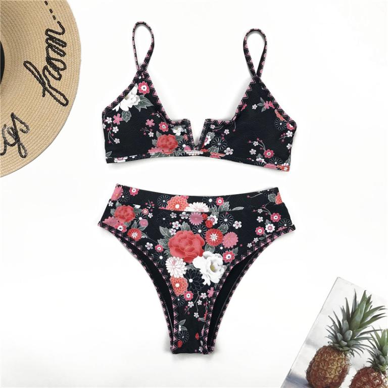Two-piece bikini in black with pink, white, and red floral print; triangle top and briefs