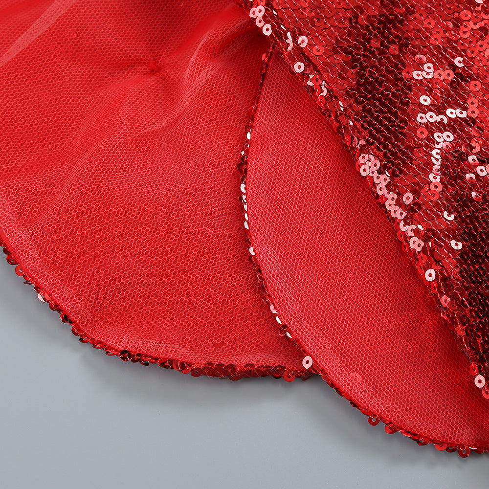 Red sequined fabric edge on a mini dress with mesh lining and scalloped hem
