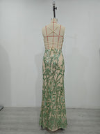Women’s green sequin maxi dress on mannequin, ornate pattern, spaghetti straps