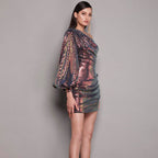 Rose gold sequin one-shoulder mini dress, side view with draped balloon sleeve