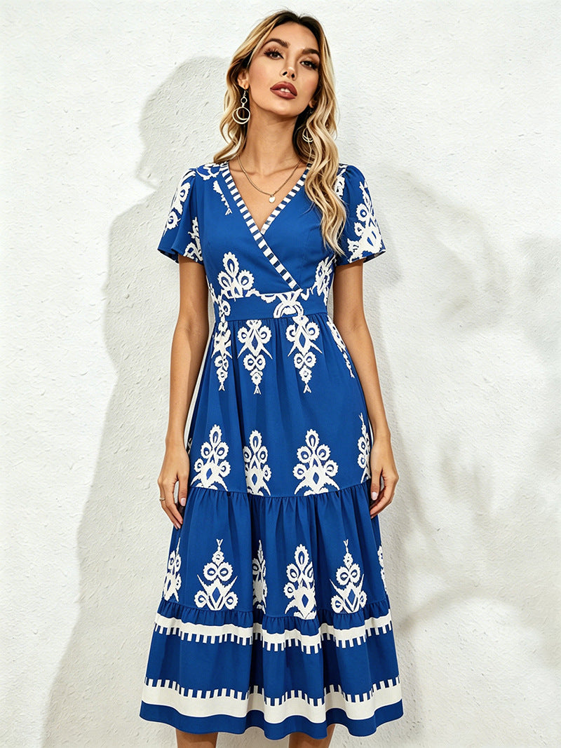 Royal blue midi short-sleeve dress with V-neck and white floral embroidery, tiered hem