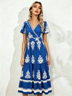 Royal blue midi short-sleeve dress with V-neck and white floral embroidery, tiered hem