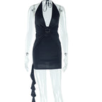 Black halter mini dress on mannequin with V neckline and waist buckle detail