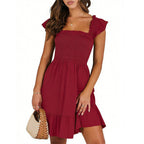 Women’s summer dress in burgundy with smocked bodice and tiered ruffle skirt