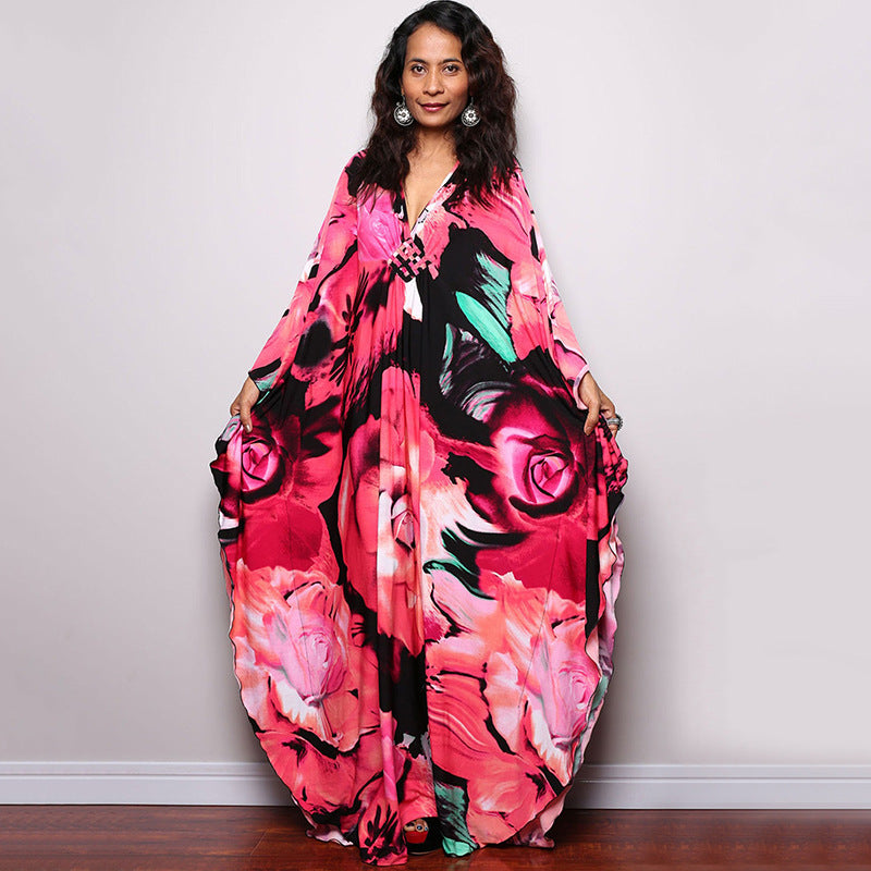 Pink rose and black floral one-piece swim dress with V-neck and loose drape