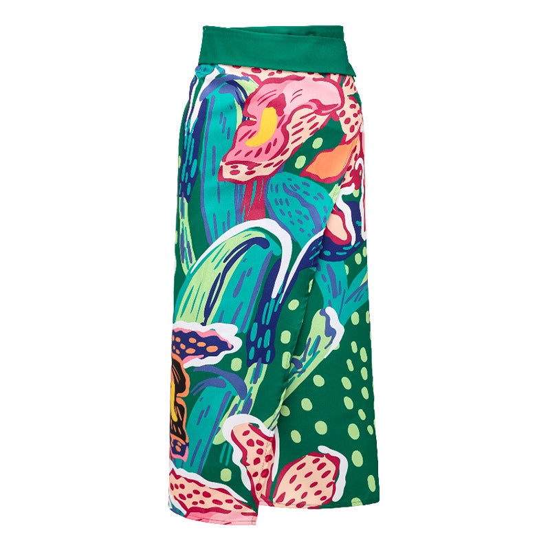Green wrap swim skirt with abstract fruit print and elastic waistband