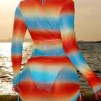 Ruched rainbow gradient long-sleeve one-piece swimsuit with gathered waist and drawstring sides.