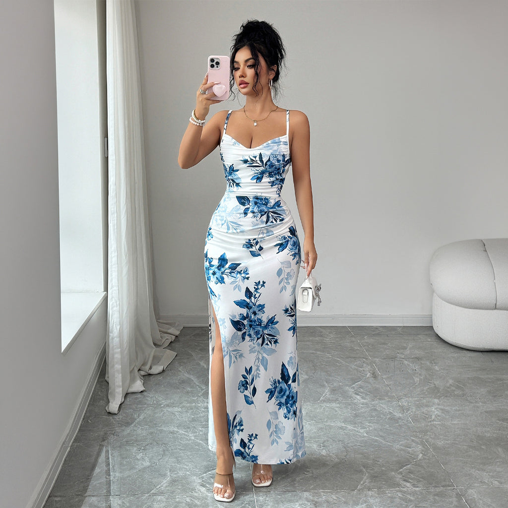Maxi sling dress with white base and blue floral print, ruched bodice, side slit
