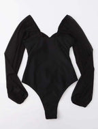 Black one-piece swimsuit with sheer long sleeves and deep V backless cut