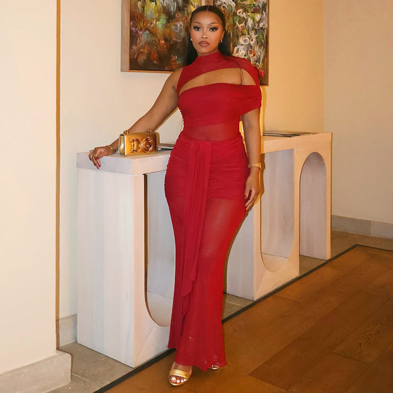 Red off-shoulder maxi dress with fitted bodice and draped, sheer long skirt