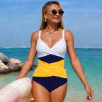 One-piece swimsuit in white, yellow, and navy color-block with V-neck twist