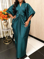 Teal satin maxi pleated dress, V-neck, side pockets, batwing sleeves