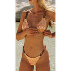 Patterned one-piece swimsuit with adjustable shoulder straps and V-neck front