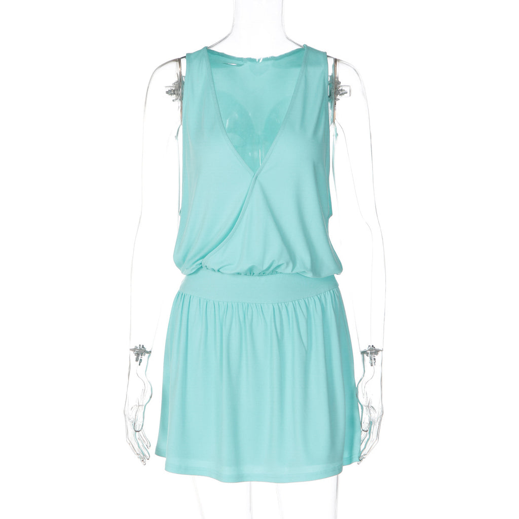 Light green sleeveless V-neck dress, cinched waist, tiered flared skirt