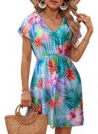 Blue V-neck short-sleeve dress with tropical floral print and gathered waist