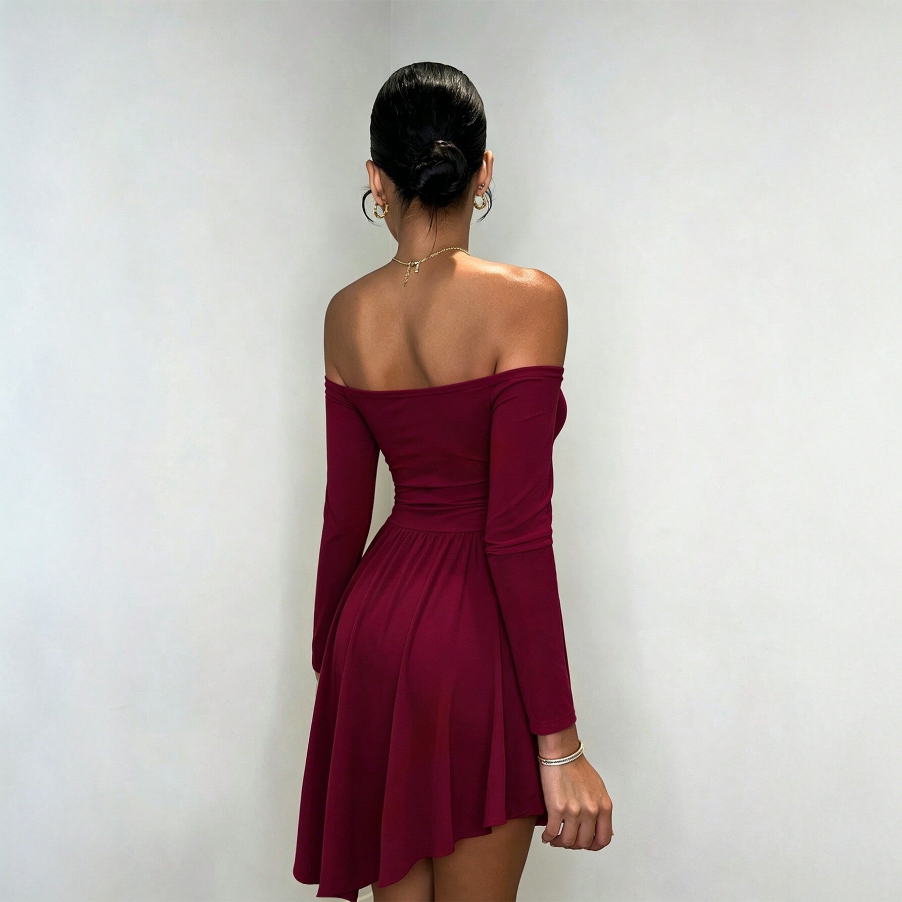 Burgundy off-shoulder long-sleeve dress with ruched back waist and pleated skater skirt