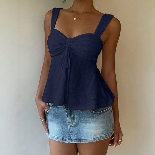 Blue sleeveless sling top with gathered bust bow and eyelet pattern