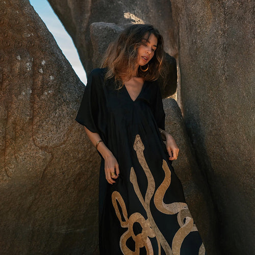 Black beach dress cover-up with V-neck, flowy short sleeves, gold side motif