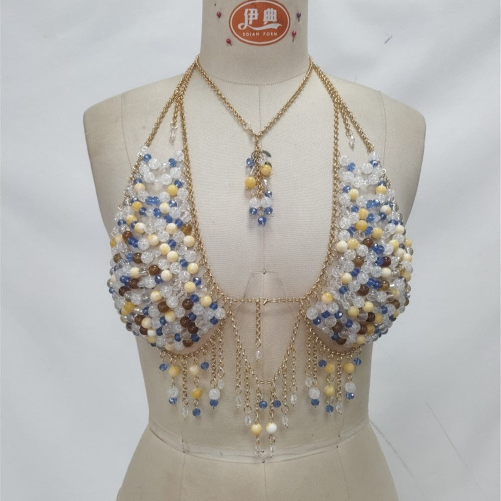Beaded gem tassel chest vest on mannequin with blue and gold bead clusters and fringe drops