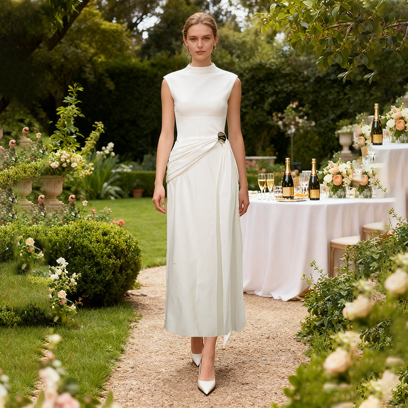 Ivory sleeveless midi dress with high neckline and waist tie bow