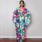 Colorful one-piece beach swim dress with V-neck, flowy maxi drape and tropical floral print