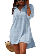 Light blue textured V-neck mini dress with long sleeves and button-front placket