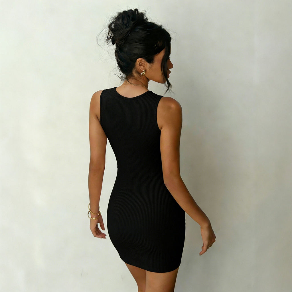 Black ribbed sleeveless mini dress with waist twist detail (back view).