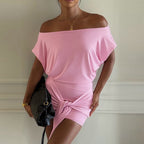 Pink off-shoulder sheath dress with short dolman sleeves and ruched waist tie