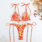 Orange floral triangle bikini with lace-up tie straps and high-cut matching bottom