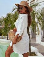 White textured V-neck mini dress with long sleeves and button-front detail