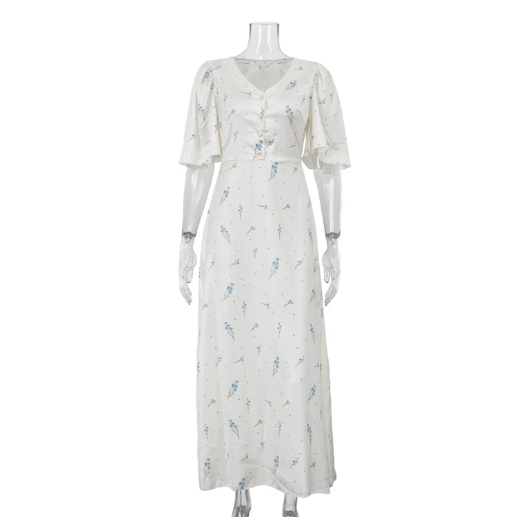 Ivory satin maxi dress with V-neck, button front and blue floral print