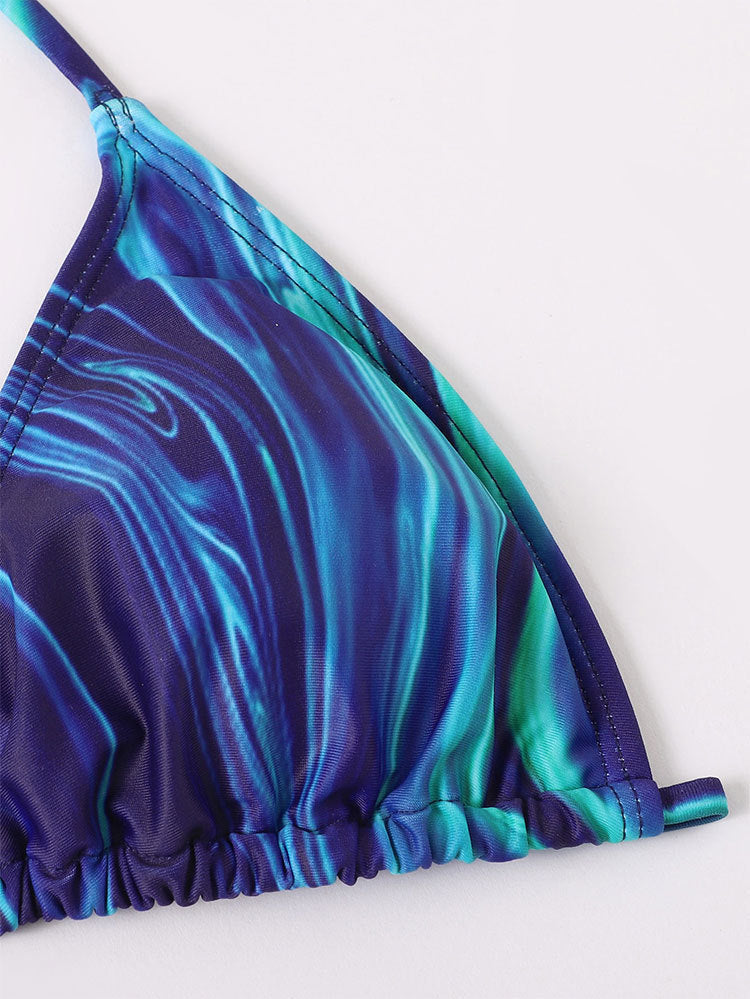 Printed blue halter swimsuit top with ruched drawstring hem and long sleeve cuff