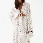 Women's polka dot long-sleeve dress with V-neck tie and open neckline