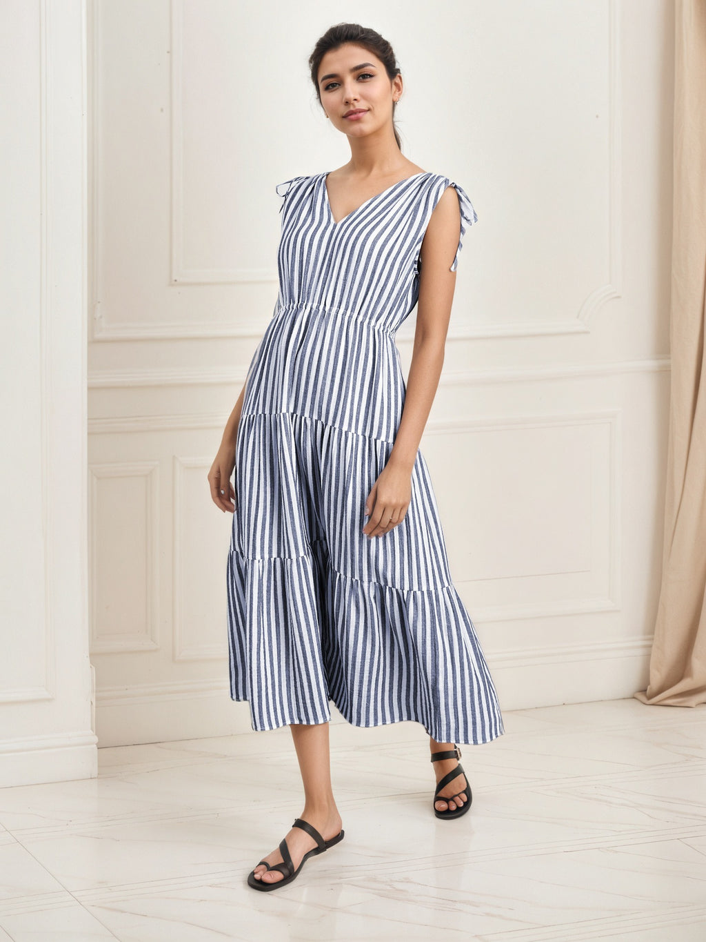 Blue-and-white striped sleeveless midi dress with tiered layers and V-neck