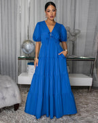 Royal blue tiered maxi dress with puff sleeves and V-neck front.