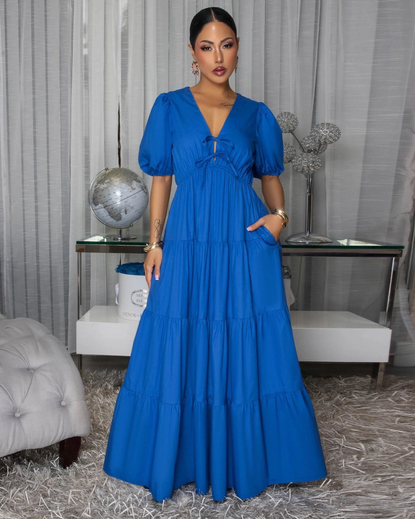 Royal blue tiered maxi dress with puff sleeves and V-neck front.