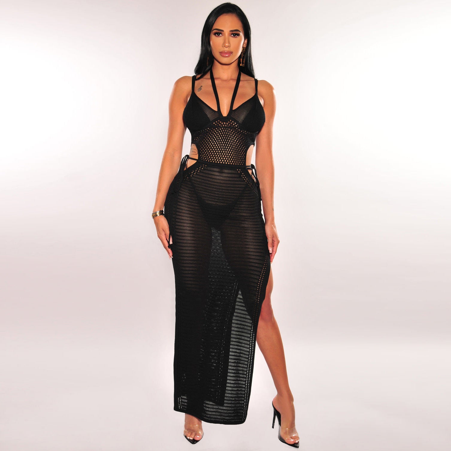 Black backless halter maxi dress with open back, mesh texture and crisscross top detail