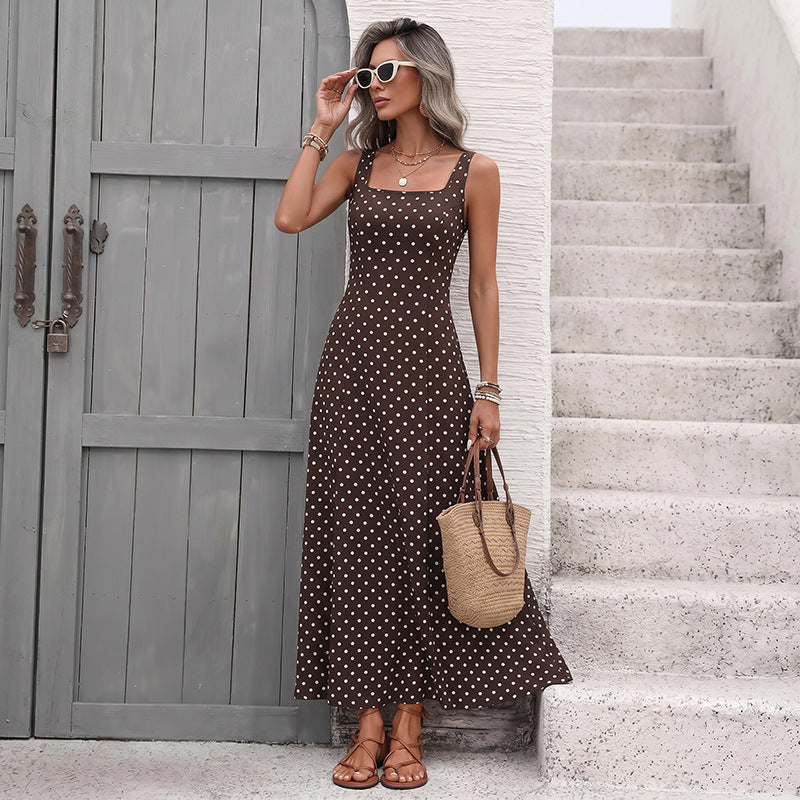 Coffee brown sleeveless polka dot ankle-length dress, front view with sunglasses
