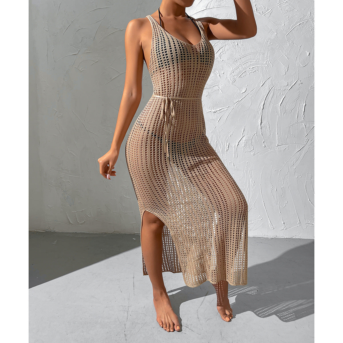 Beige knitted maxi dress with scoop neck, sleeveless design, and openwork pattern