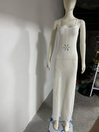 White crochet bodycon beach dress with spaghetti straps and small floral patch