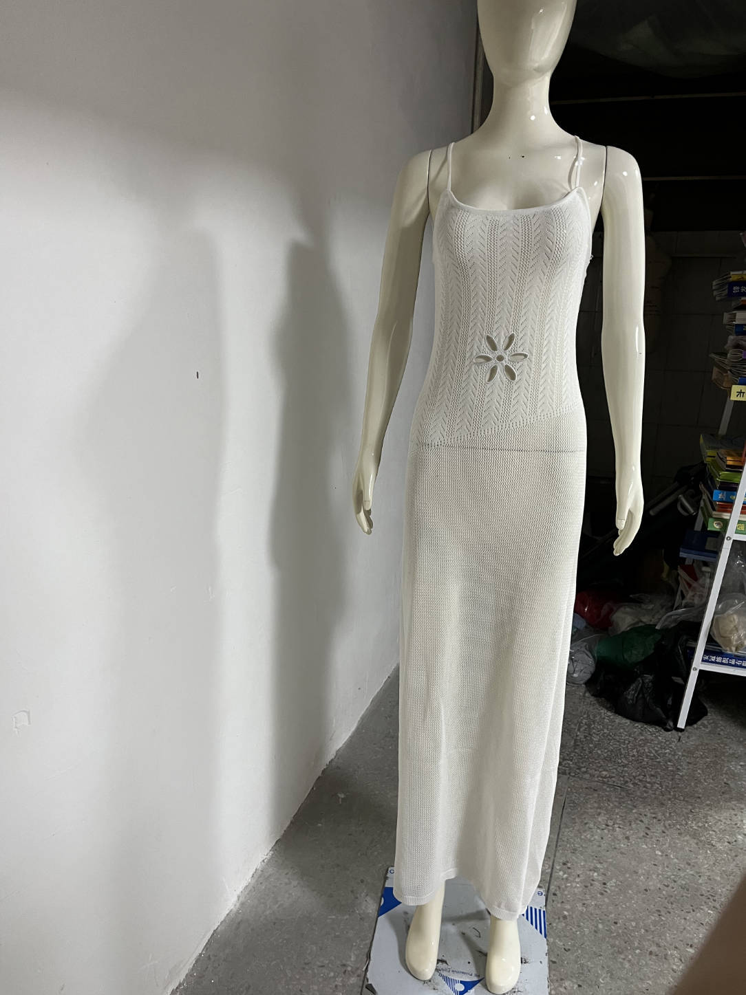 White crochet bodycon beach dress with spaghetti straps and small floral patch